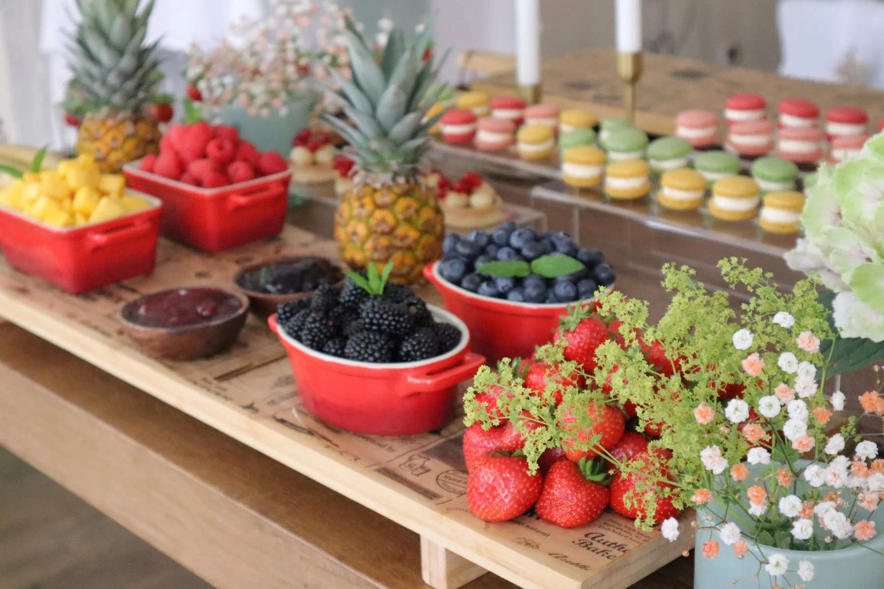 Fresh fruit, berries and macarons on the buffet at a gathering at Haus Jordans, Neuss