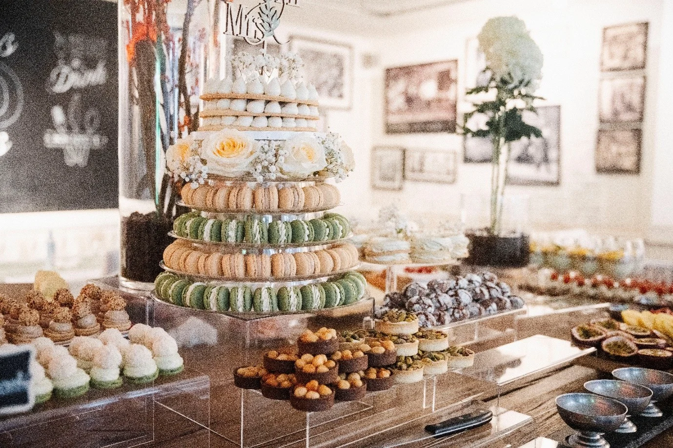 Dessert buffet with macaron tower and pastries on acrylic stands at Haus Jordans, Neuss