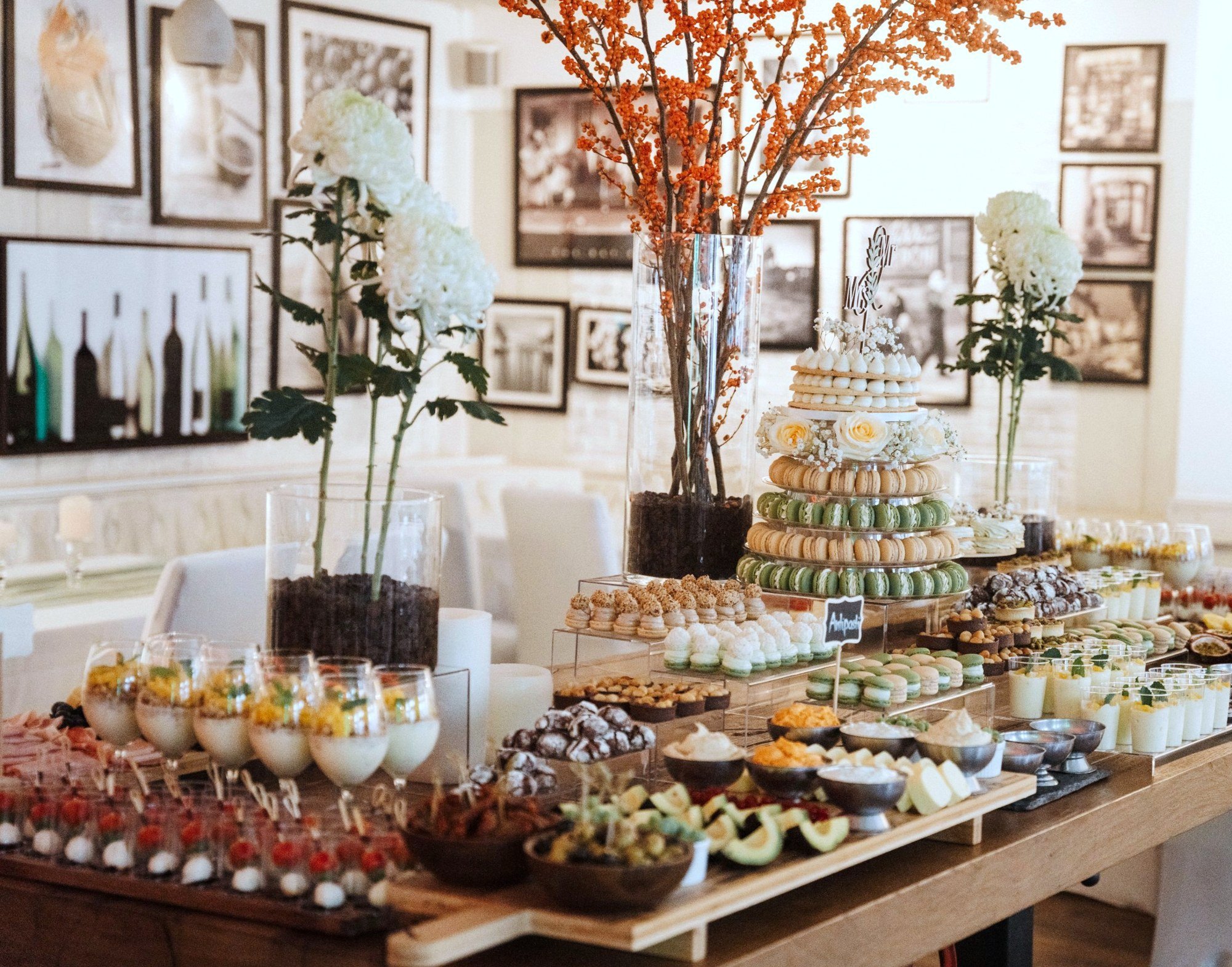 Dessert buffet with macaron tower at a celebration at La Maison