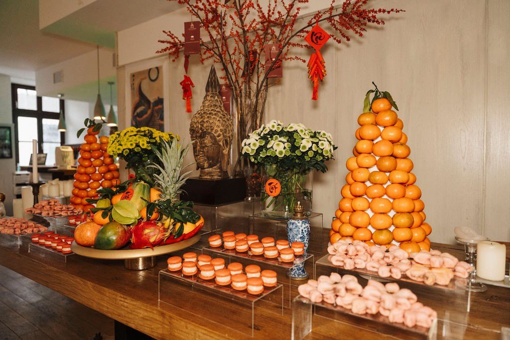 Mandarin towers and macarons on the Tết table